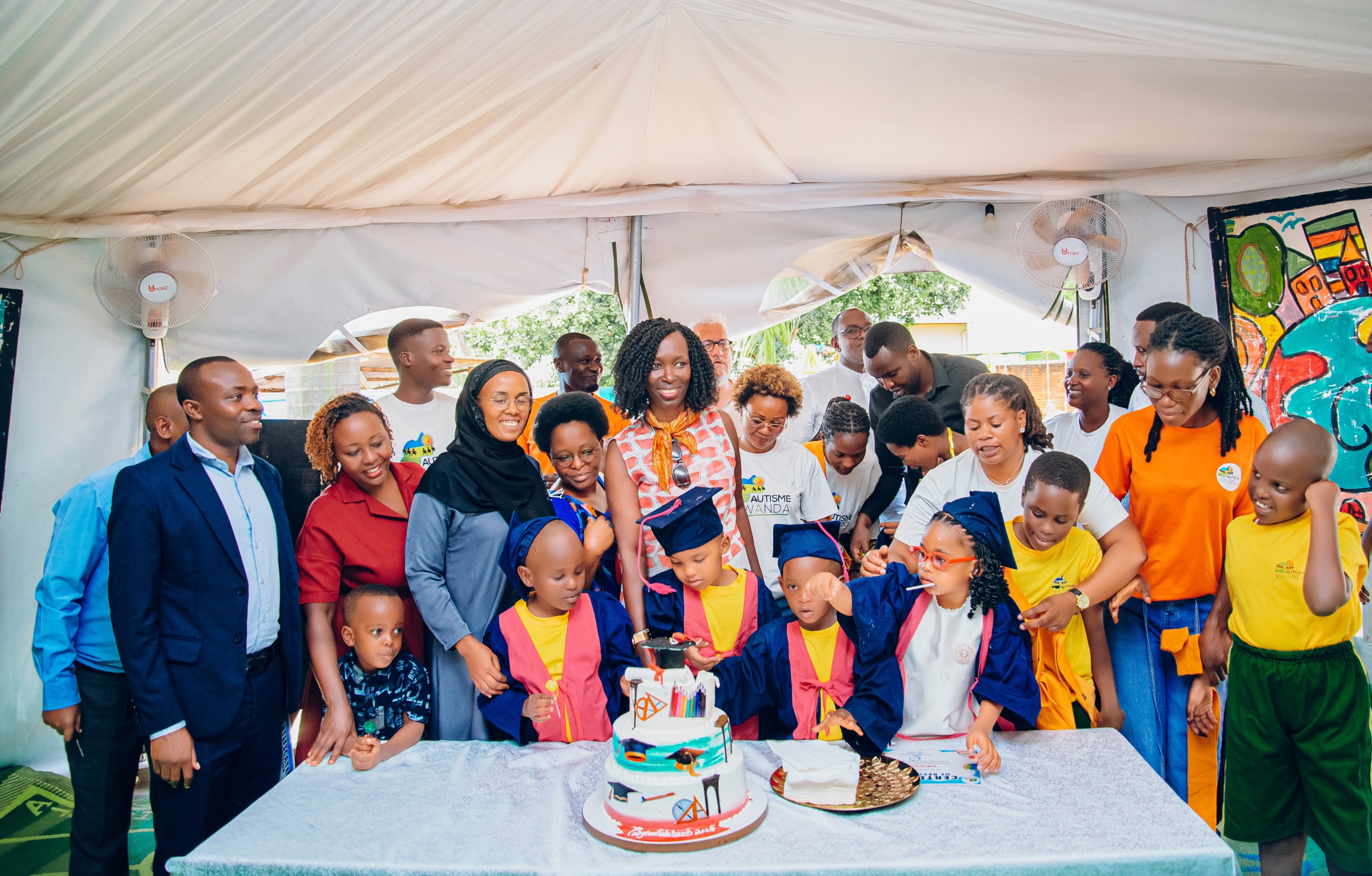 Children, families and Autisme Rwanda team members celebrating together