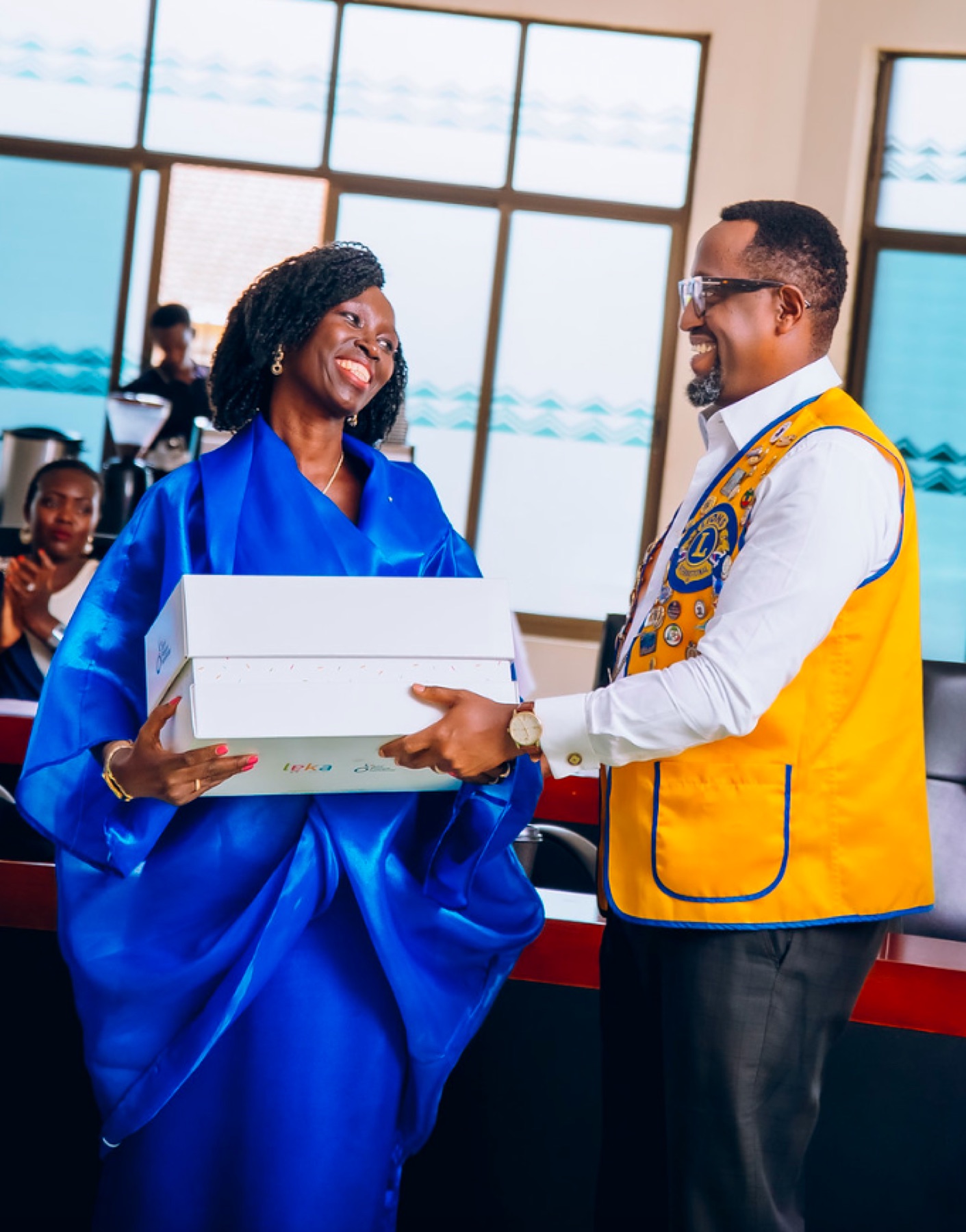 Community partner presenting an award to Autisme Rwanda