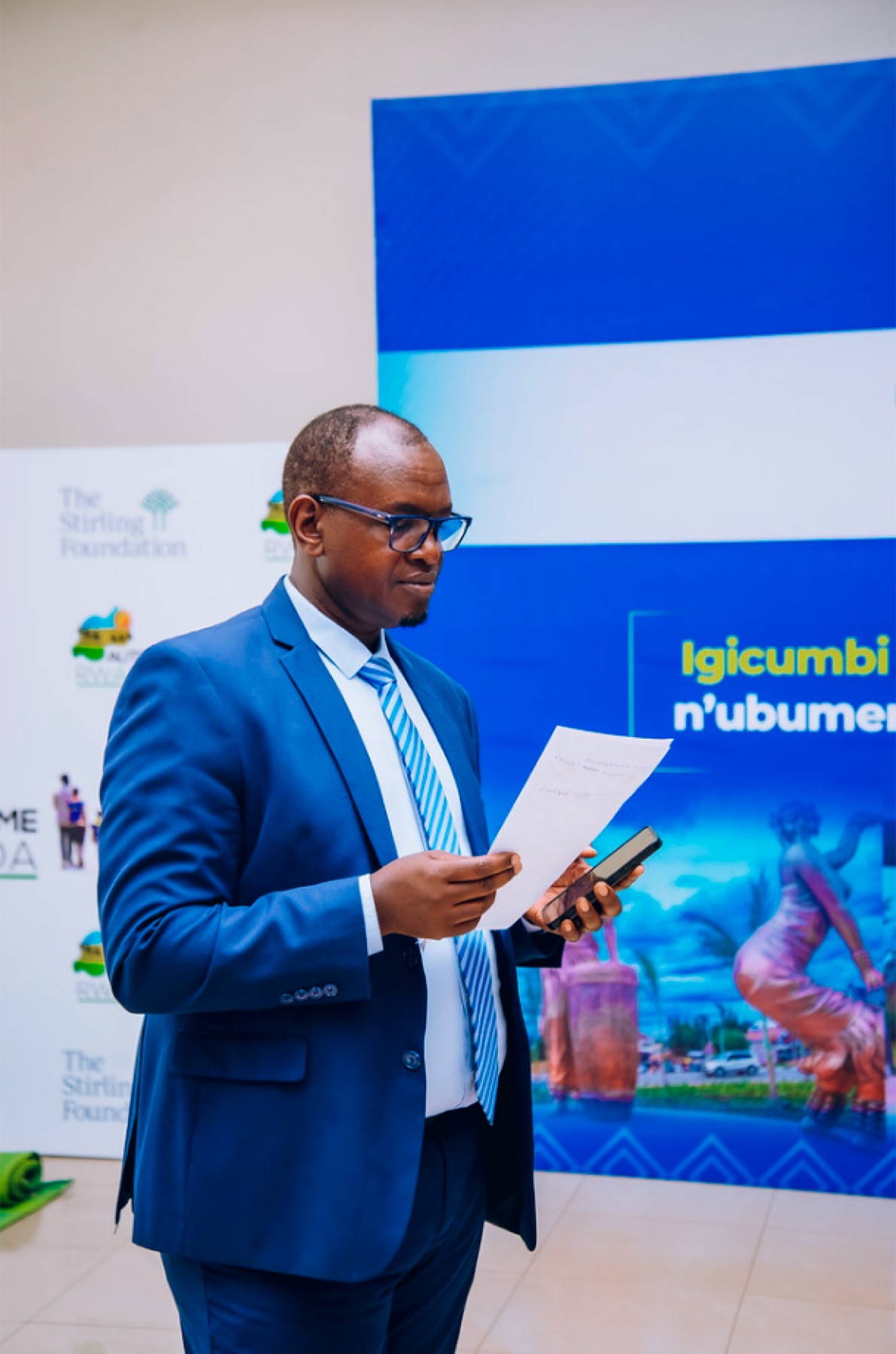 Moderator preparing remarks at the Kicukiro forum
