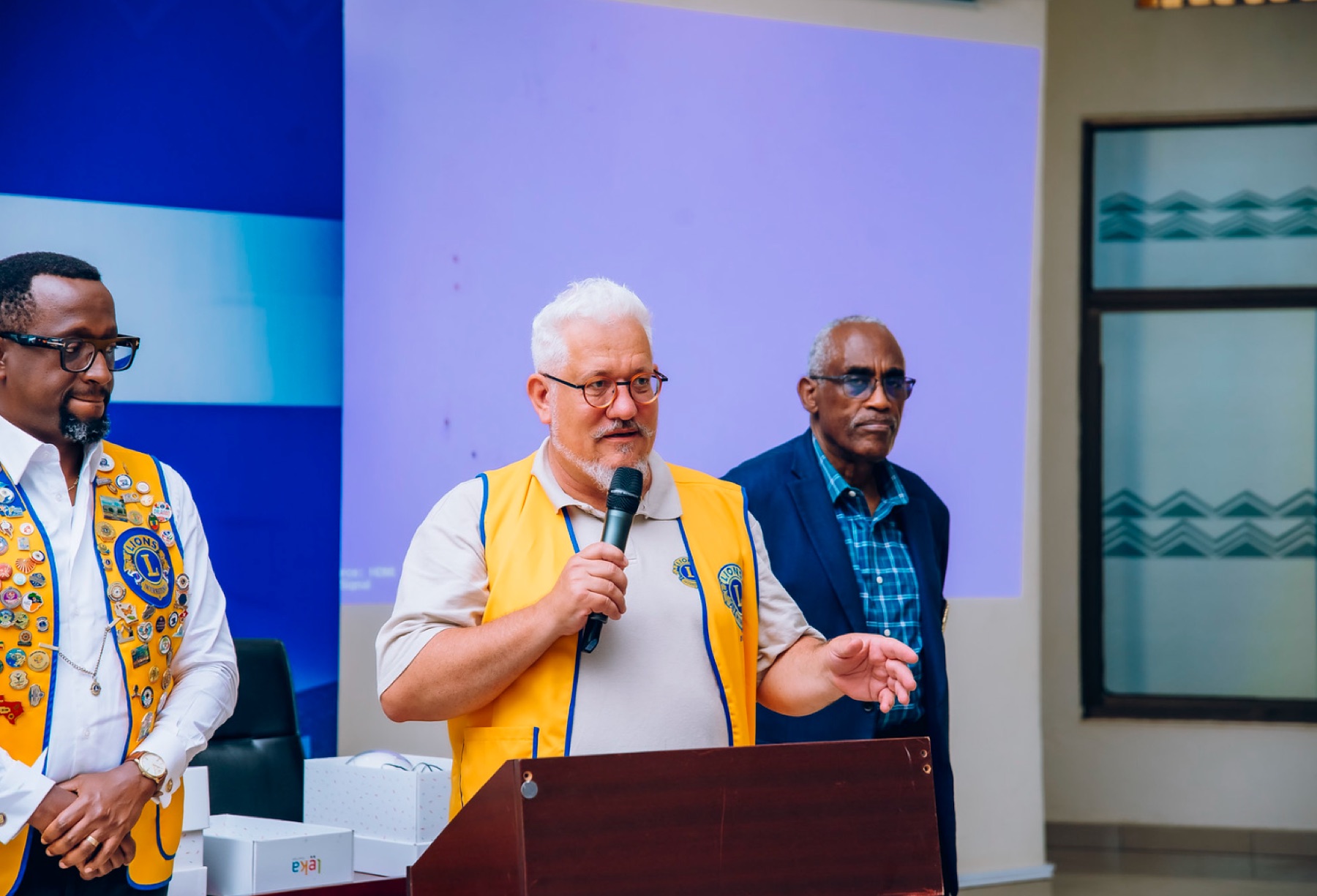 Lions Club representative speaking at the podium