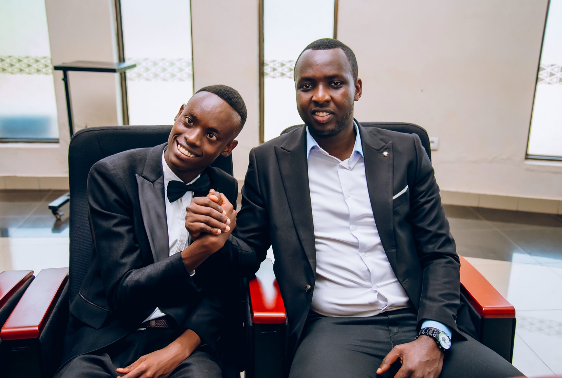 Young advocate sharing a supportive moment with a community mentor