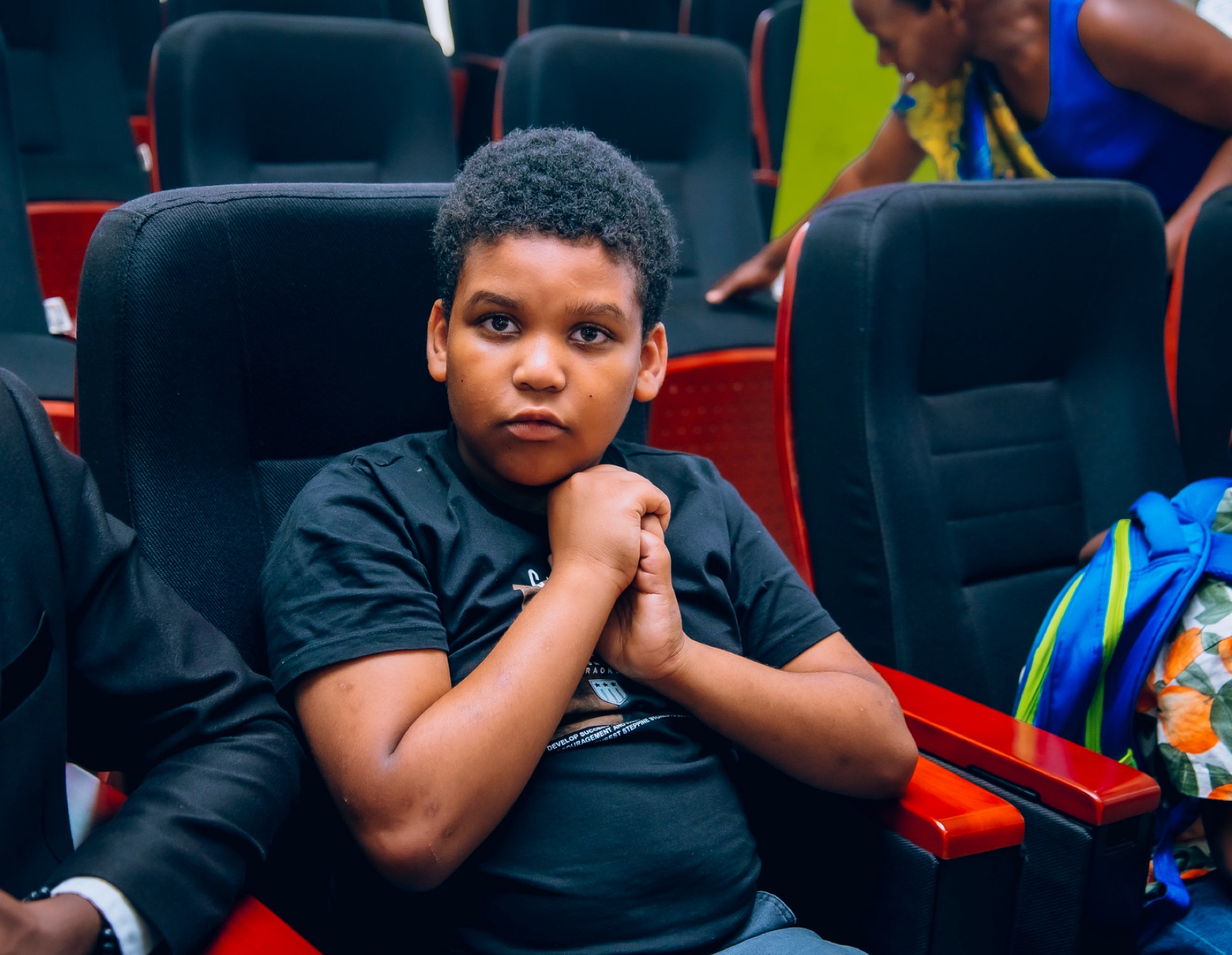 Young participant listening during the autism inclusion event